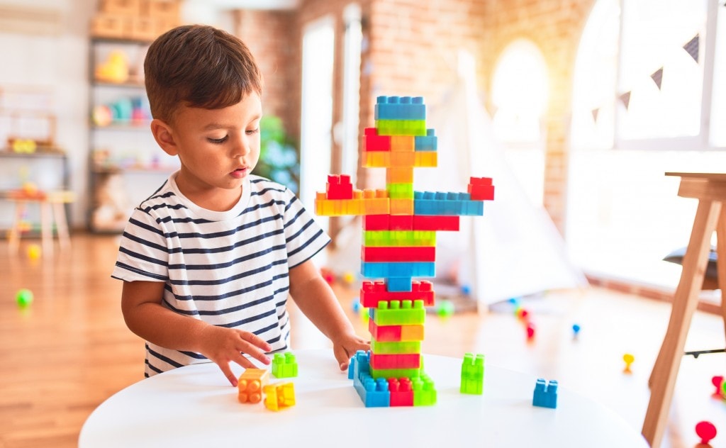 Beautiful-toddler-boy-playing-with-construction-blocks-at-kindergarten-1185931783_2209x1363-1024x632